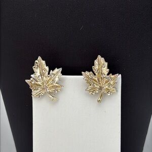 Gold tone textured leaf rhinestone accent screw back statement earrings